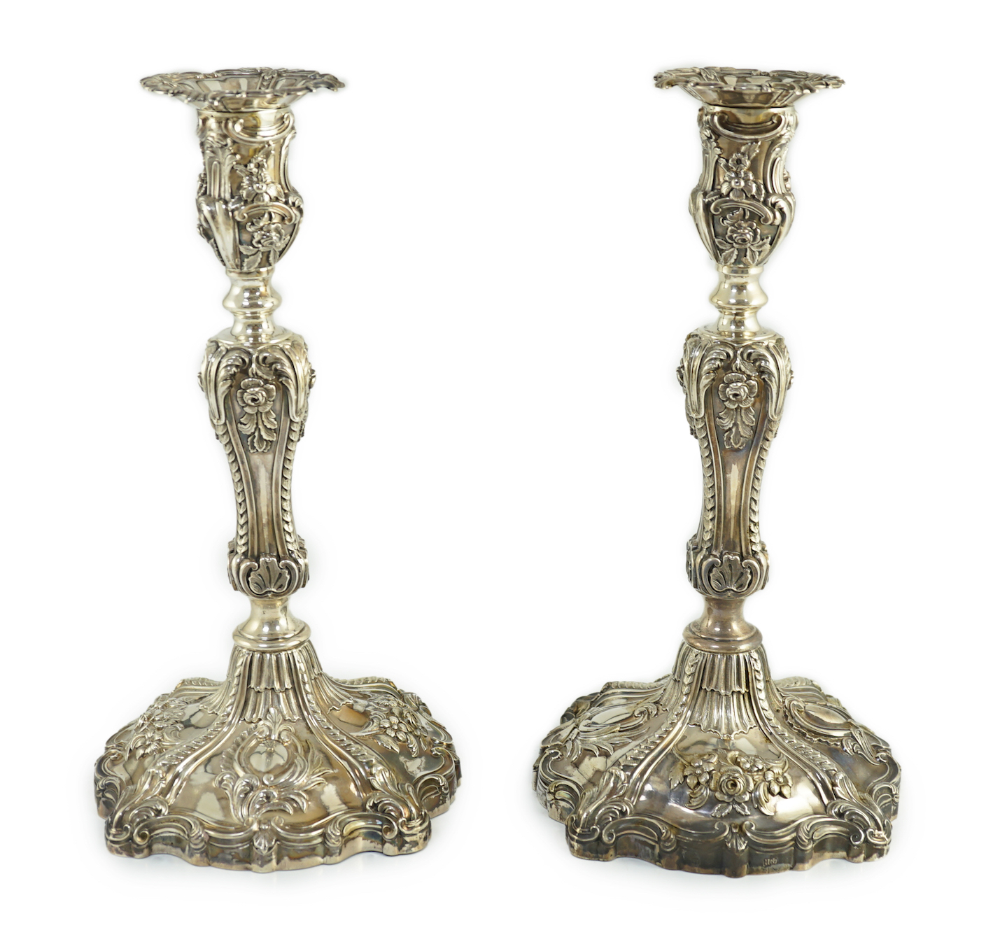 An ornate pair of early Victorian silver candlesticks by Creswick & Co